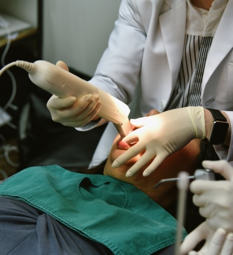 Dental patient having digital impressions taken of their teeth