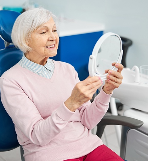 Woman smiling in the dental chair