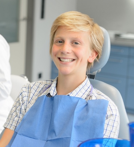 Boy smiling in dental chair