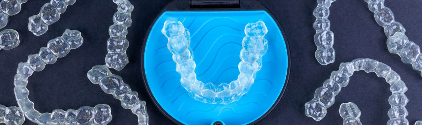 Pile of clear aligners in Allen on a table