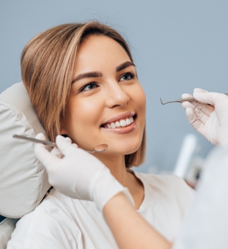 Woman smiling at her dentist during a dental checkup